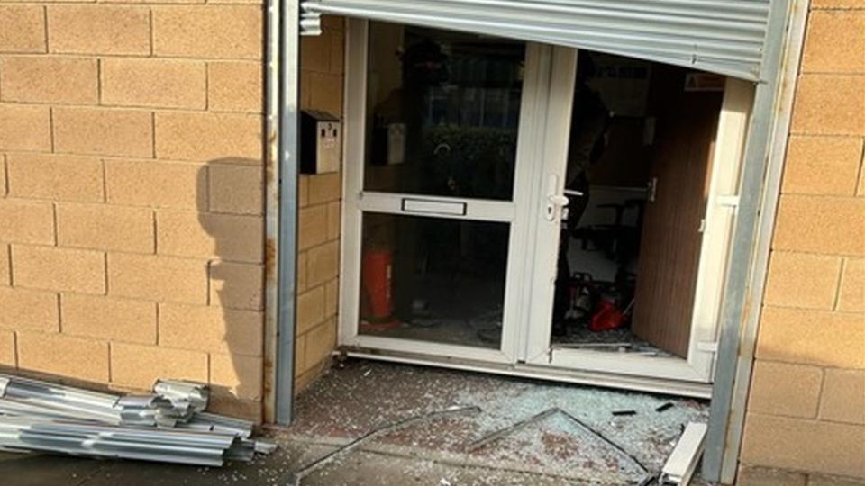 The damaged entrance to the industrial unit