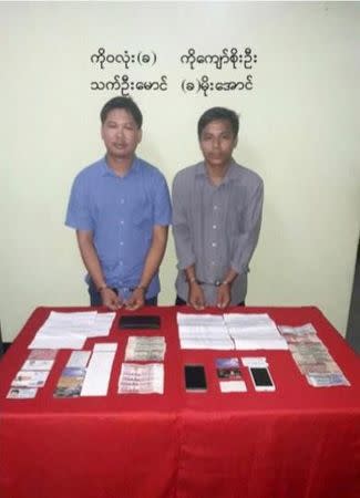 Reuters journalists, Wa Lone (L) and Kyaw Soe Oo, are seen in a photo, released on December 13, 2017 by Myanmar Ministry of Information, after they were arrested. Myanmar Ministry of Information /Handout via REUTERS