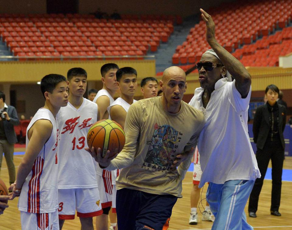 Former NBA basketball star Rodman takes part in a practice session with North Korean basketball players in Pyongyang