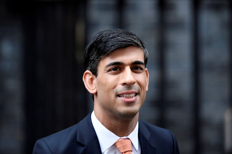 FILE PHOTO: FILE PHOTO: Newly appointed Britain's Chancellor of the Exchequer Rishi Sunak leaves Downing Street in London