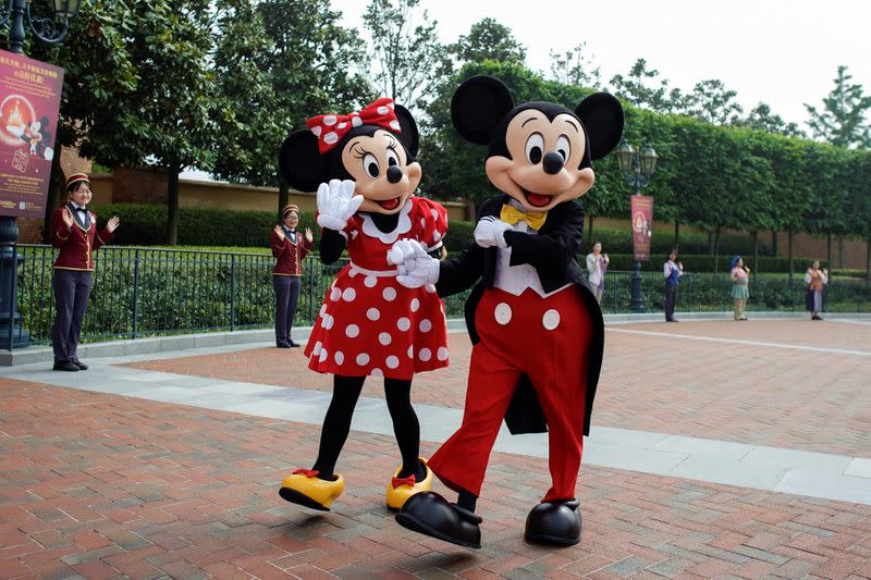 Disney characters Mickey Mouse and Minnie Mouse are seen at Shanghai Disney Resort as the Shanghai Disneyland theme park reopens following a shutdown due to the coronavirus disease (COVID-19) outbreak, in Shanghai