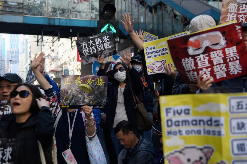 Protesters attend a Human Rights Day march