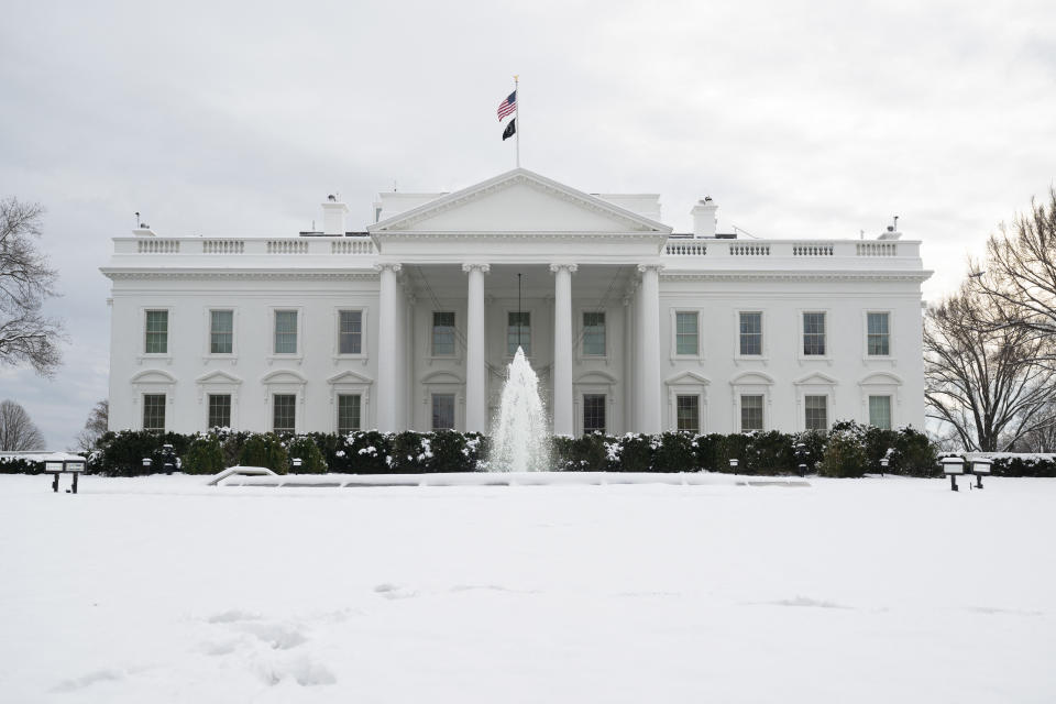 Snow blankets the North Lawn of the White House.