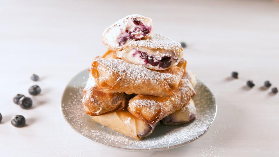 <p>You won't find these egg rolls on the take-out menu.</p><p>Get the recipe from <a href="https://www.delish.com/cooking/recipe-ideas/a20125643/blueberry-cheesecake-egg-rolls-recipe/" rel="nofollow noopener" target="_blank" data-ylk="slk:Delish.;elm:context_link;itc:0;sec:content-canvas" class="link ">Delish.</a></p>