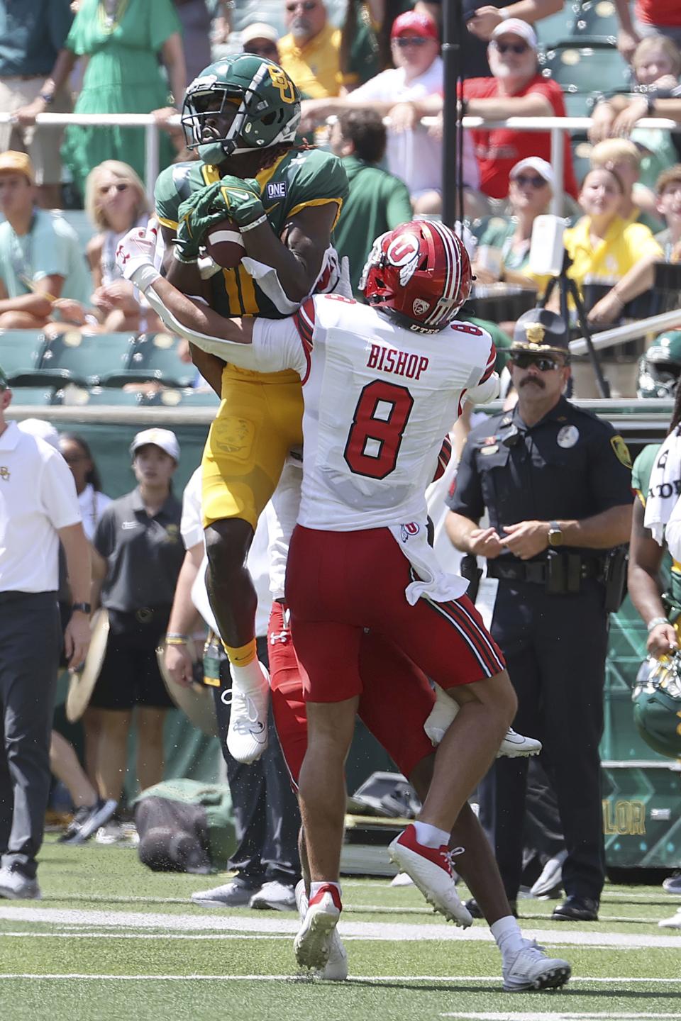 Baylor wide receiver Ketron Jackson Jr. (11) catches the ball over Utah safety Cole Bishop in the first half of an NCAA college football game, Saturday, Sept. 9, 2023, in Waco, Texas. (AP Photo/Jerry Larson) | AP