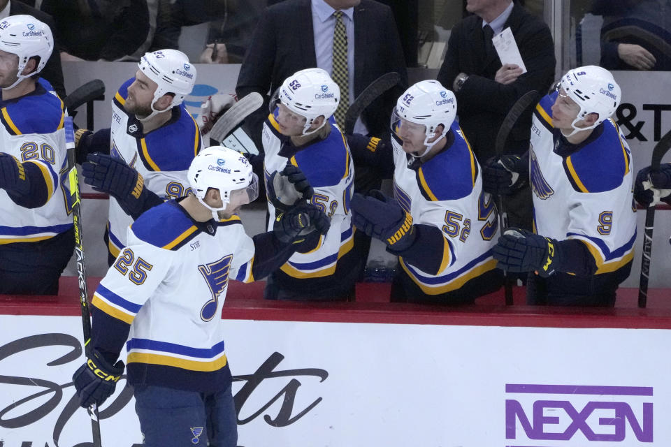 St. Louis Blues' Jordan Kyrou celebrates his goal with teammates during the second period of an NHL hockey game against the Chicago Blackhawks Wednesday, Nov. 16, 2022, in Chicago. (AP Photo/Charles Rex Arbogast)