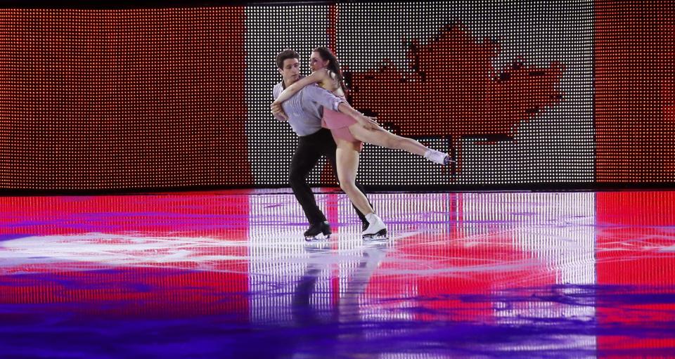 Canada's Tessa Virtue and Scott Moir perform during the Figure Skating Gala Exhibition at the Sochi 2014 Winter Olympics, February 22, 2014. REUTERS/Alexander Demianchuk (RUSSIA - Tags: SPORT FIGURE SKATING SPORT OLYMPICS)