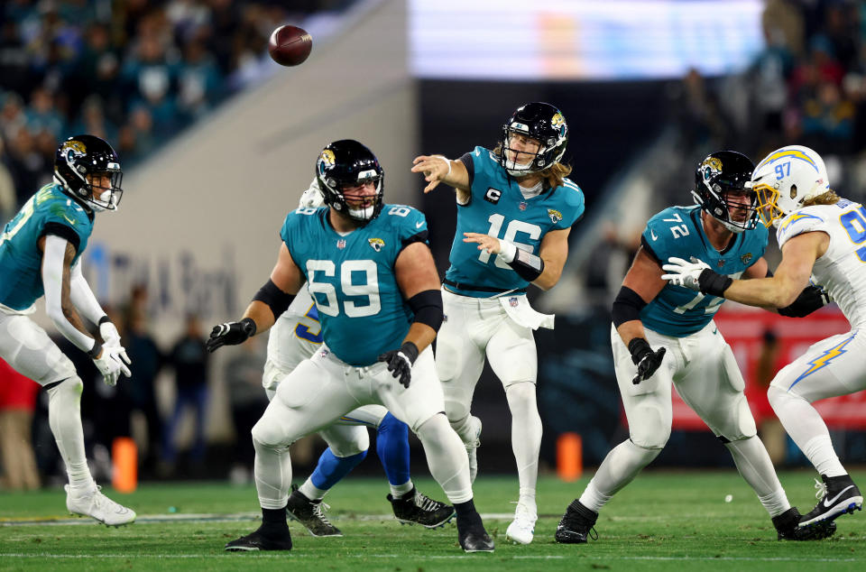 Jan 14, 2023; Jacksonville, Florida, USA; Jacksonville Jaguars quarterback Trevor Lawrence (16) throws during the first quarter of a wild card game against the Los Angeles Chargers at TIAA Bank Field. Mandatory Credit: Mark J. Rebilas-USA TODAY Sports