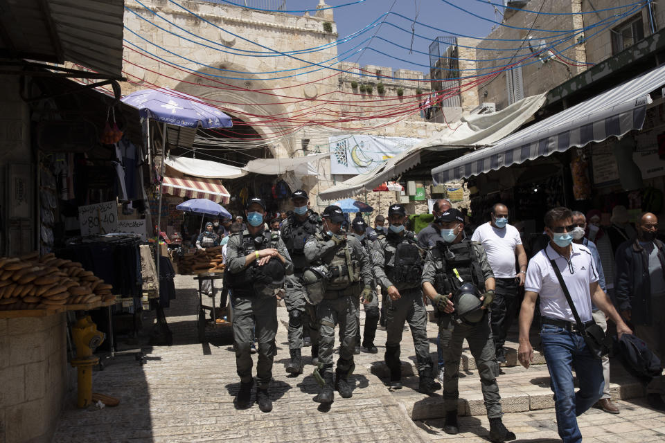 Israeli Border Police patrol the Old City of Jerusalem as worshippers arrive for Friday prayers during the Muslim holy month of Ramadan, on Friday, April 23, 2021. Israeli police say 44 people were arrested and 20 officers were wounded in a night of chaos in Jerusalem, where security forces separately clashed with Palestinians angry about Ramadan restrictions and Jewish extremists who held an anti-Arab march nearby. (AP Photo/Maya Alleruzzo)