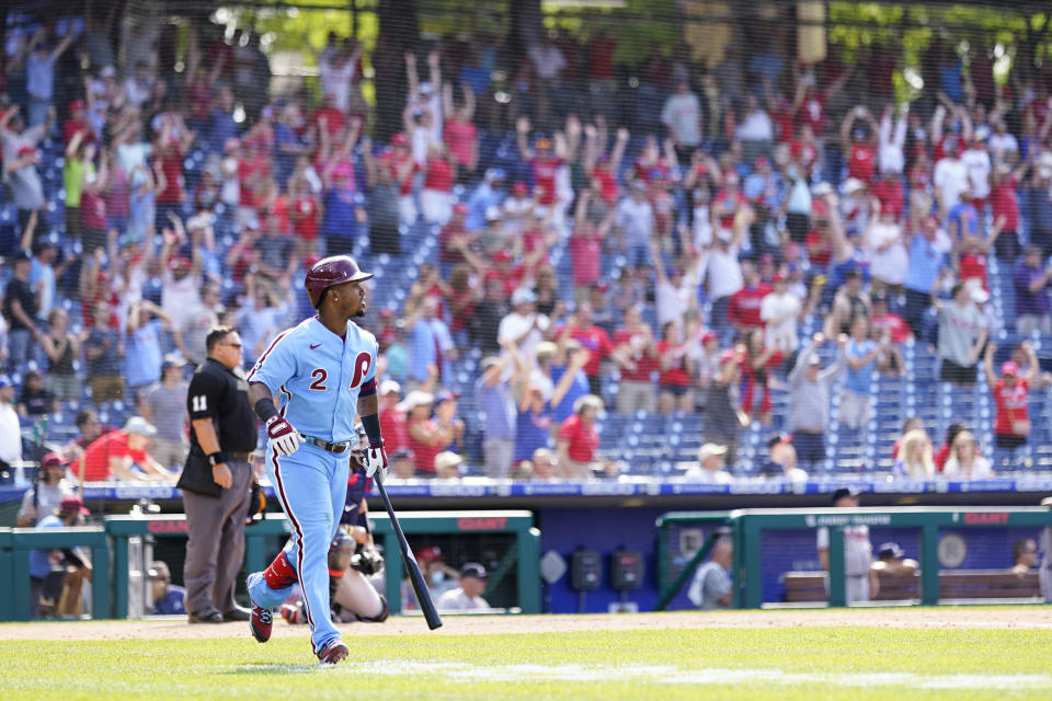 Philadelphia Phillies' Jean Segura follows through after hitting a game-winning two-run single off Atlanta Braves pitcher Chris Martin during the 10th inning of a baseball game, Thursday, June 10, 2021, in Philadelphia. (AP Photo/Matt Slocum)