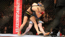 Rousey and Kaufman grapple for position in the opening minute on Saturday. (Credit: Tracy Lee for Y! Sports)