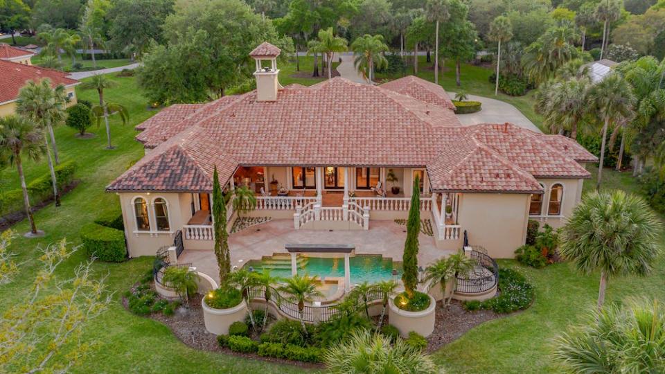 Recognized as the “Villa Constancia,”  this estate is ideally situated on a 1.4-acre lot along the sixth-hole tee box and seventh fairway of the Halifax Plantation golf course.