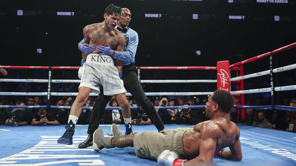 Garcia celebrates after knocking down Haney. - Cris Esqueda/Golden Boy/Getty Images