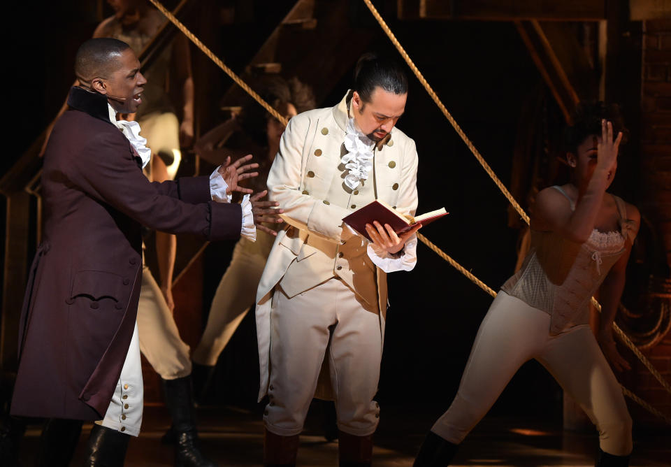 NEW YORK, NY - FEBRUARY 15:  Actor Leslie Odom, Jr. (L)  and actor, composer Lin-Manuel Miranda (R) perform on stage during 'Hamilton' GRAMMY performance for The 58th GRAMMY Awards at Richard Rodgers Theater on February 15, 2016 in New York City.  (Photo by Theo Wargo/WireImage)