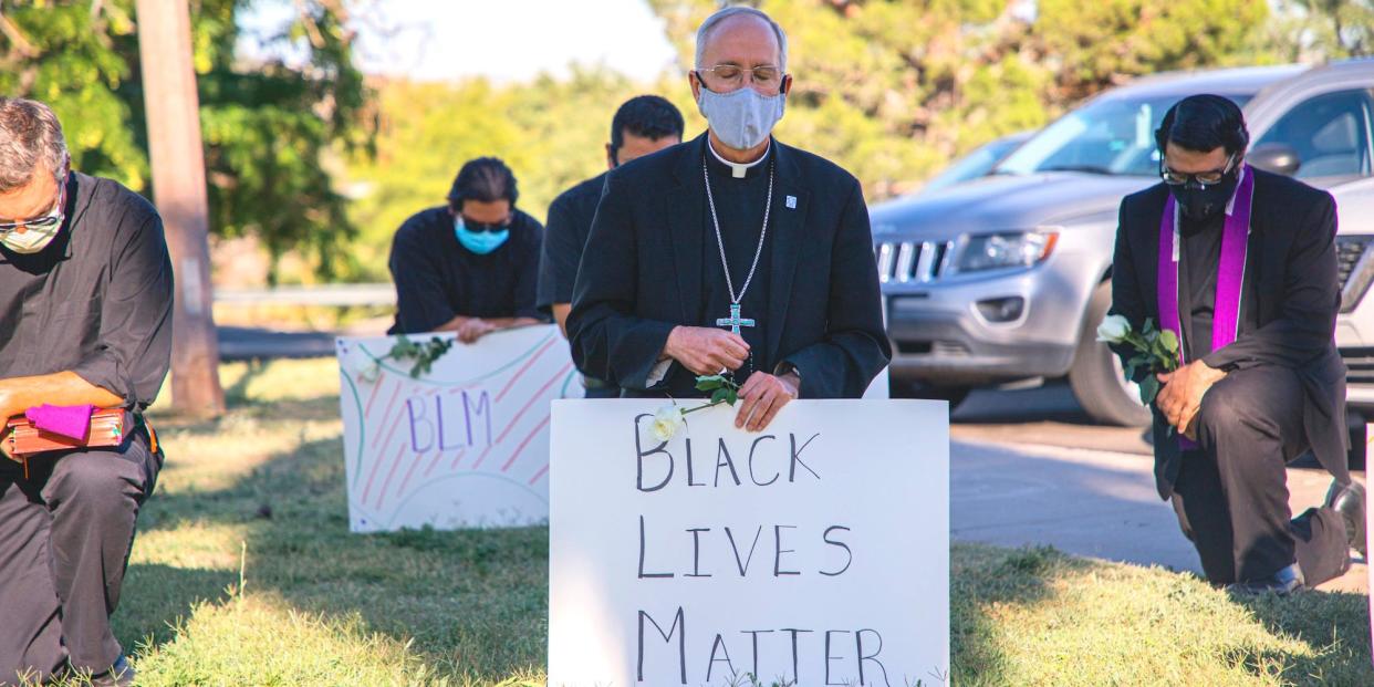 Bishop Mark Seitz takes the knee at a Black Lives Matter rally in El Paso, Texas, on June 1, 2020.