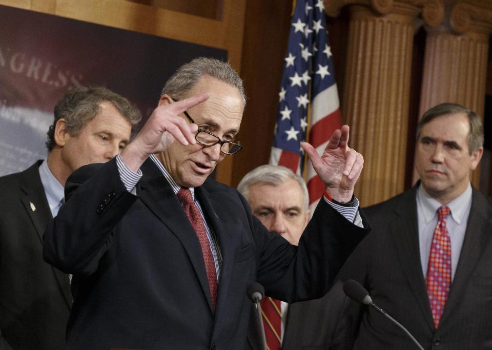 Sen. Charles Schumer, D-N.Y., second from left, gestures during a news conference on Capitol Hill in Washington, Tuesday, Jan. 7, 2014, after legislation to renew jobless benefits for the long-term unemployed unexpectedly cleared an initial Senate hurdle. From left are, Sen. Sherrod Brown, D-Ohio, Schumer, Sen. Jack Reed, D-R.I., and Sen. Jeff Merkley, D-Ore. The vote was 60-37 to limit debate on the legislation, with a half-dozen Republicans siding with the Democrats on the test vote. Sen. Jack Reed, D-R.I., along with Republican Sen. Dean Heller of Nevada, led the effort to reauthorize the benefits for three months which expired on Dec. 28. (AP Photo/J. Scott Applewhite)