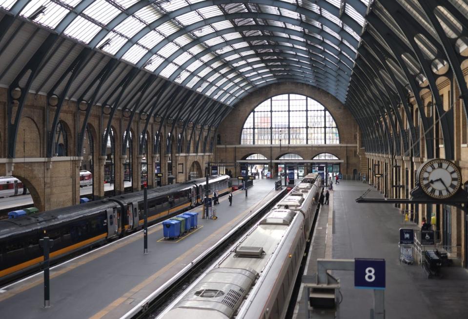 Trains wait on platforms at Kings Cross station in London (EPA/NEIL HALL)