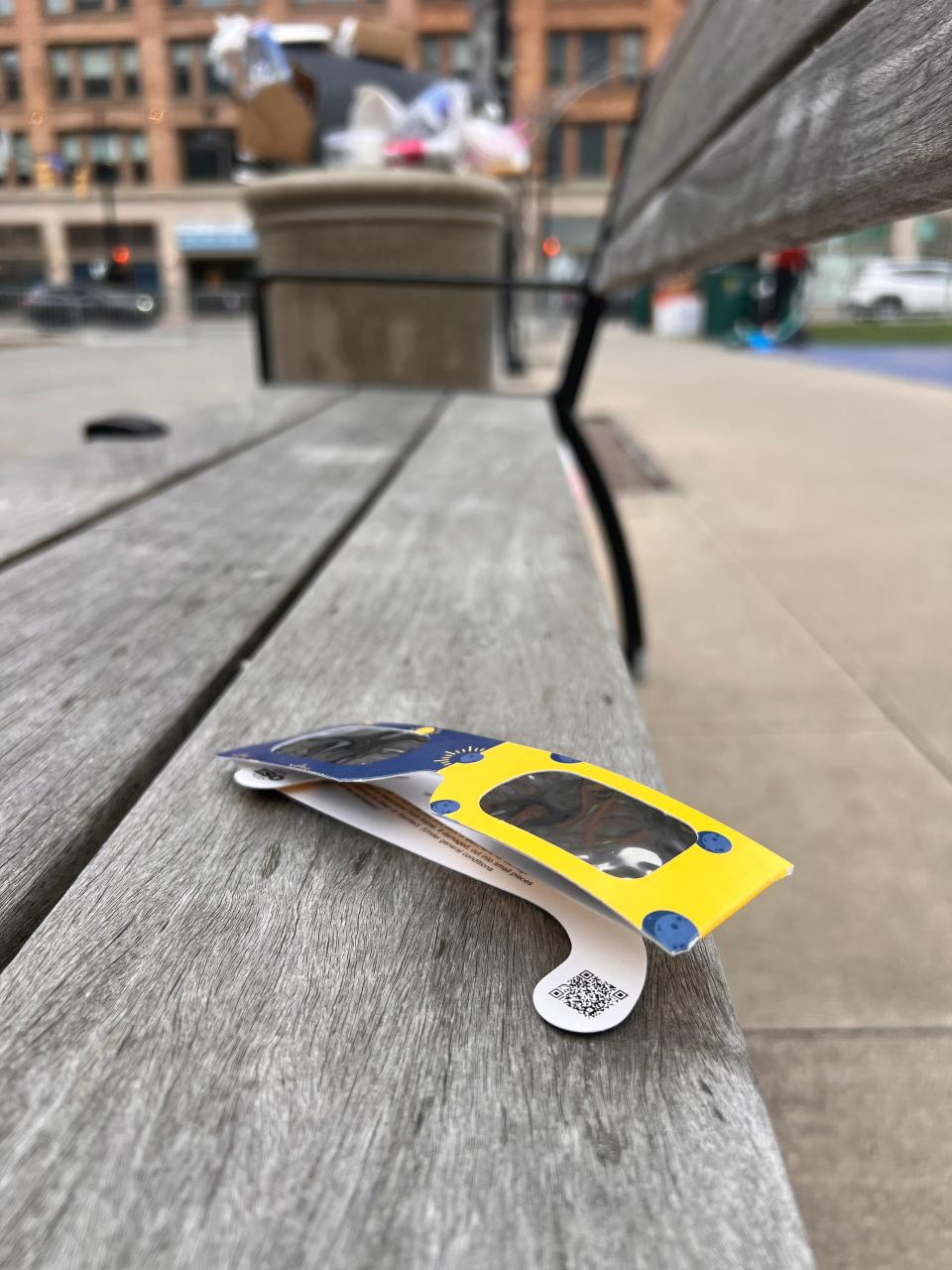 A pair of solar glasses lay discarded on a bench on Parcel 5 Monday. Because of the cloud cover in Rochester, the glasses were uneccesary.