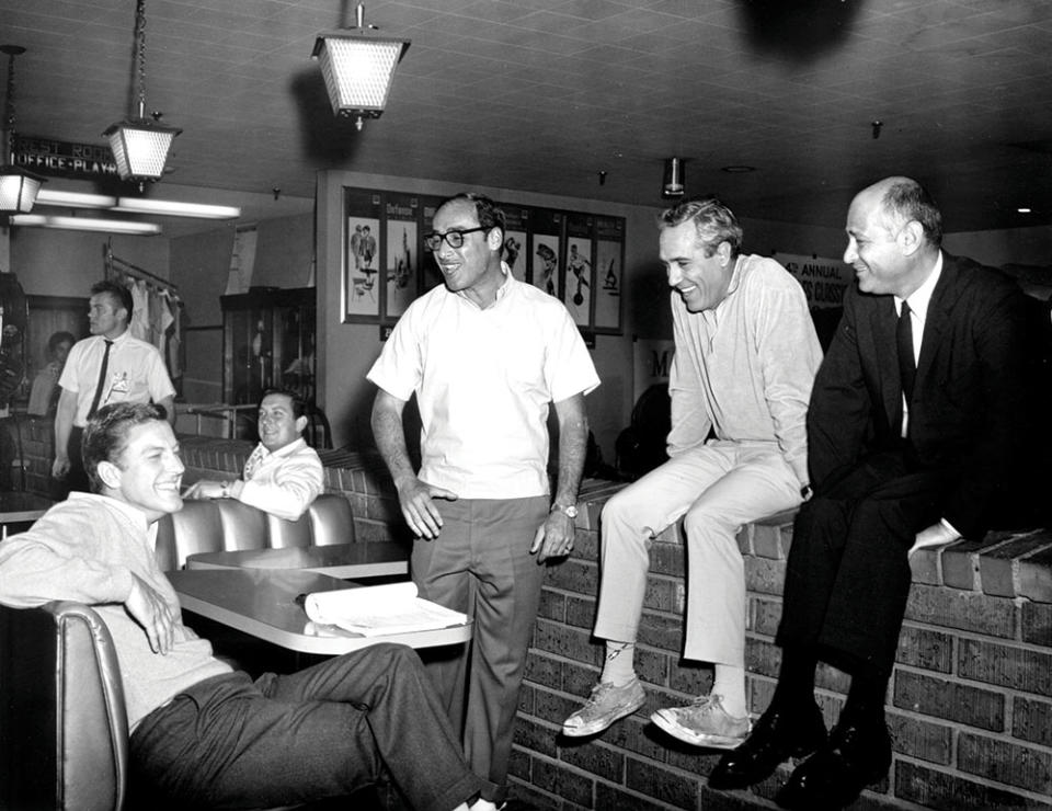 Before sitcom domination, Lear was partners with Bud Yorkin, who directed the Lear-penned script for the 1967 marital satire Divorce American Style. On set, from left: Dick Van Dyke, Yorkin, Jason Robards and Lear.