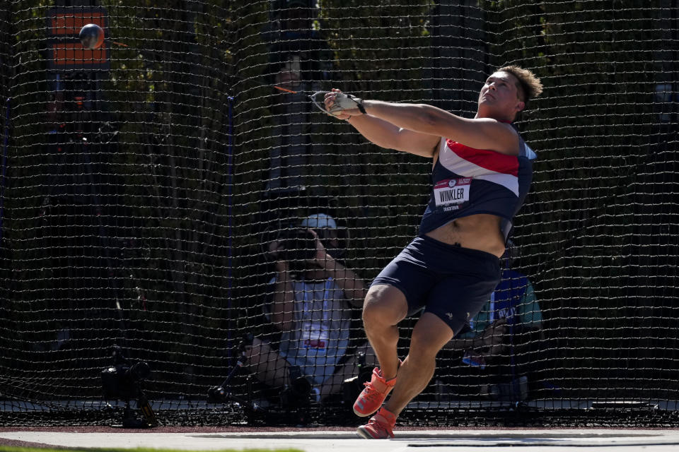 Rudy Winkler sets an American record during the finals of the men's hammer throw event at the U.S. Olympic Track and Field Trials Sunday, June 20, 2021, in Eugene, Ore. (AP Photo/Ashley Landis)