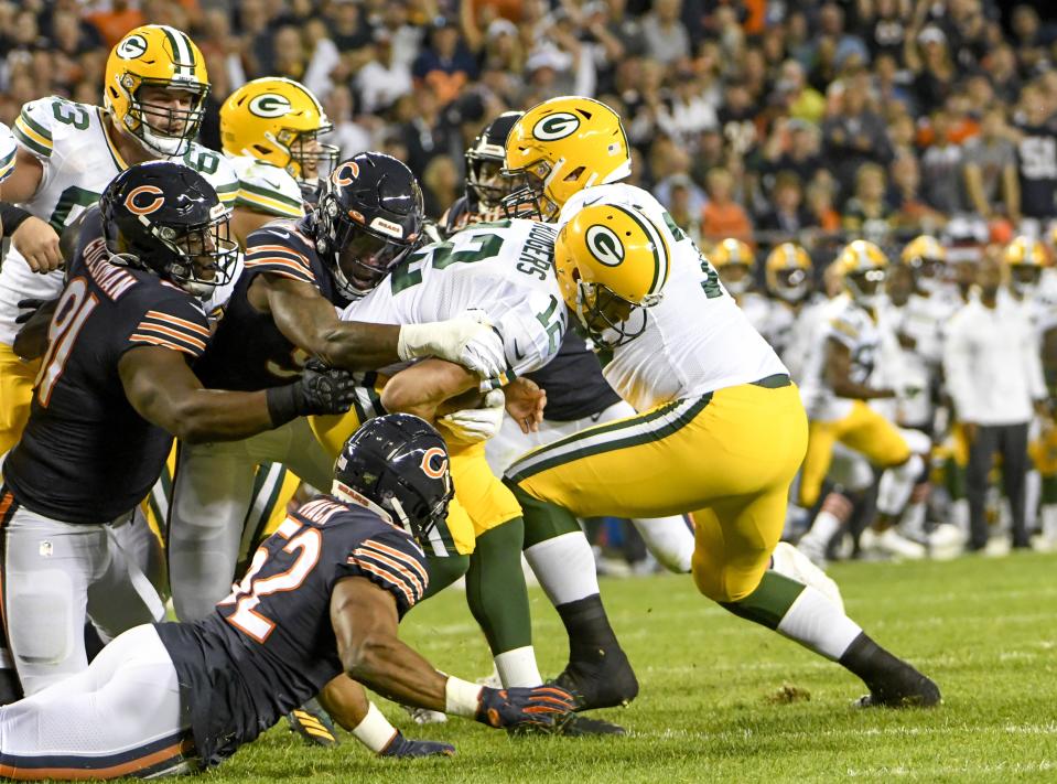 Green Bay Packers' Aaron Rodgers is sacked by Chicago Bears' Leonard Floyd during the first half of an NFL football game Thursday, Sept. 5, 2019, in Chicago. (AP Photo/David Banks)