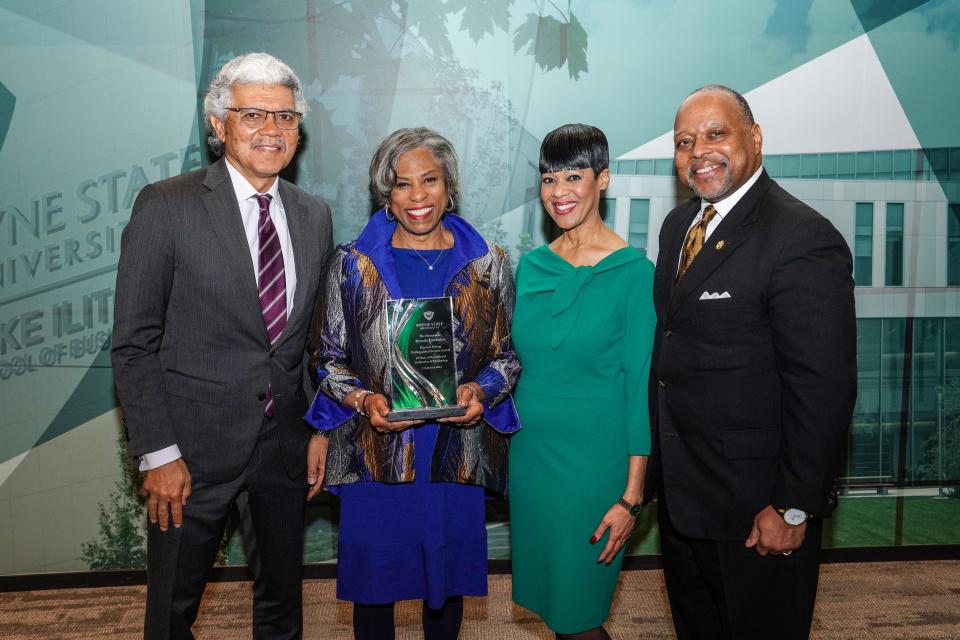 Wayne State University's director of community affairs Stacie Clayton was all smiles, and, in her element on Jan. 13, as former U.S. congresswoman Brenda Lawrence received the Warrior Strong Distinguished Service Award during "A Tribute to Rev. Dr. Martin Luther King Jr.," presented by Wayne State University. Lawrence also was joined by Wayne State University President M. Roy Wilson and Wayne State University Vice President of Government and Community Affairs Patrick Lindsey.