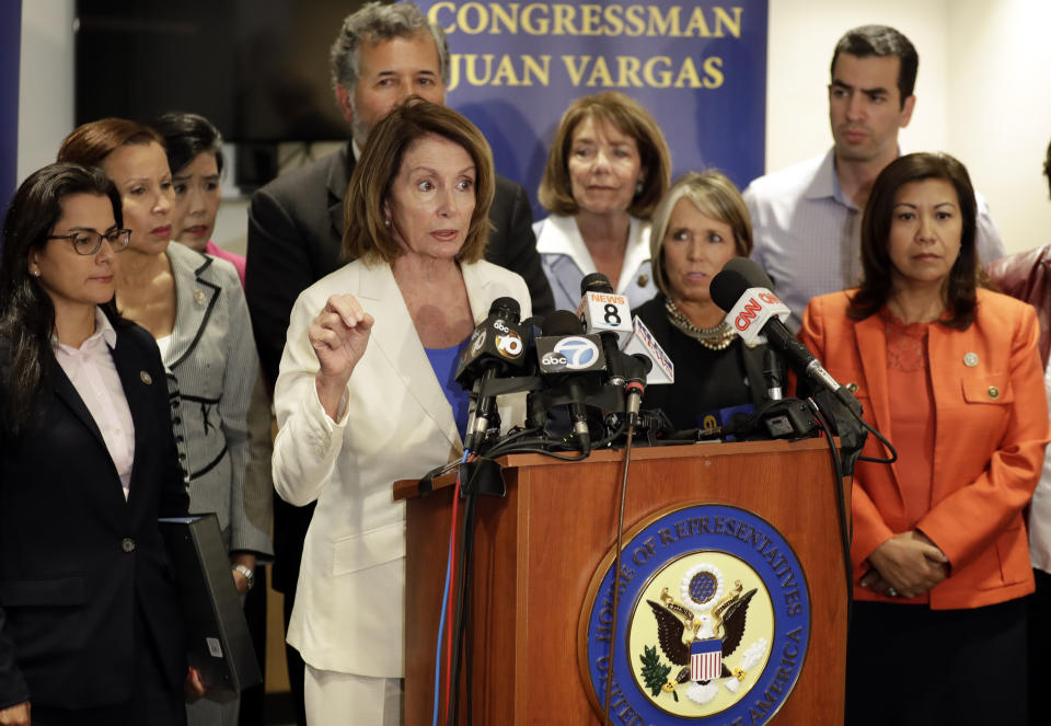 <span class="s1">House Minority Leader Nancy Pelosi, D-Calif., surrounded by members of the Congressional Hispanic Caucus, talks about their visit to a detention facility near San Diego. (Photo: Gregory Bull/AP)</span>