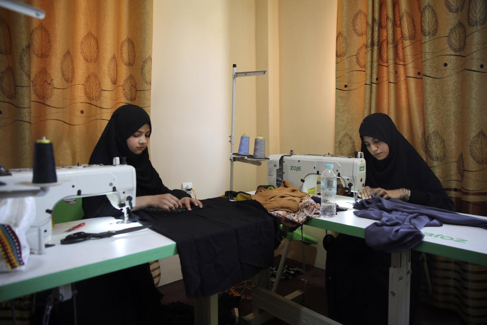 Afghan women tailors work with a sewing machine in the Afghan Women Business Hub in Kabul, Afghanistan, Tuesday, July 2, 2024. Half of Afghanistan's population now finds itself locked out of the freedom to work at a time when the country's economy is worse than ever, with few jobs available to women in the country.(AP Photo/Siddiqullah Alizai)