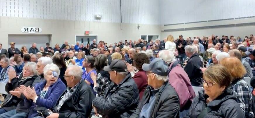 A screenshot from a video recording shows a large crowd of people attended a public meeting with Premier Tim Houston at the Heatherton Community Centre in Antigonish County on Tuesday evening. The topic was the proposed consolidation of town and county