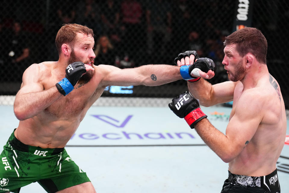 LAS VEGAS, NEVADA – MARCH 23: (L-R) Trey Ogden punches Kurt Holobaugh in a lightweight fight during the UFC Fight Night event at UFC APEX on March 23, 2024 in Las Vegas, Nevada. (Photo by Chris Unger/Zuffa LLC via Getty Images)