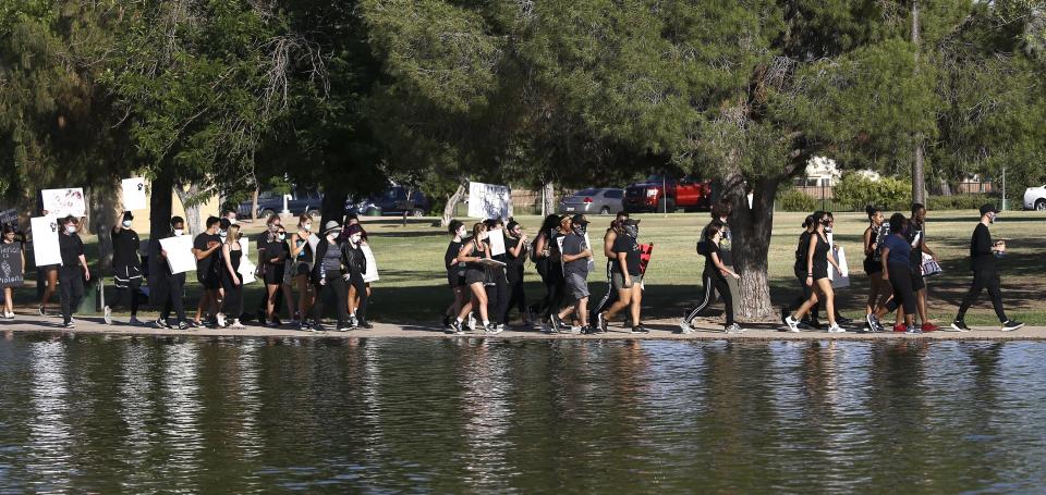 Protesters march during a June 3 rally at Cesar Chavez Park in Laveen, Arizona. (Photo: Ross D. Franklin/Associated Press)