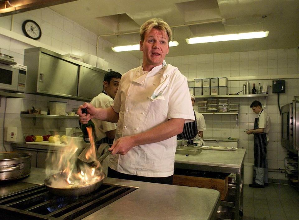 British Chef Gordon Ramsay inside the kitchen of his Chelsea restaurant on 19 January 2001, after being awarded three Michelin stars (GERRY PENNY/AFP via Getty Images)