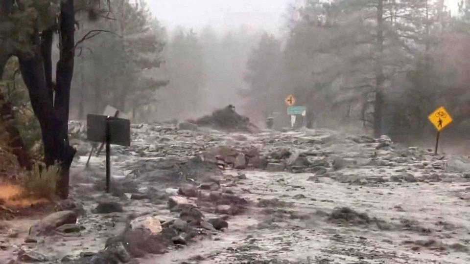 PHOTO: Gushing flood water and debris rush down a roadway during Tropical Storm Hilary, in Angeles National Forest, Calif., Aug. 20, 2023, in an image from video. (California Dept. of Transportation via Reuters)