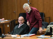 Defendant Swiss man Daniel M., accused of spying on a German tax authority to find out how it obtained details of secret Swiss bank accounts set up by Germans to avoid tax, talks to his lawyer Hannes Linke (L) before the start of his trial on espionage charges, in the Higher Regional Court in Frankfurt am Main, Germany October 18, 2017. REUTERS Andreas Arnold/Pool