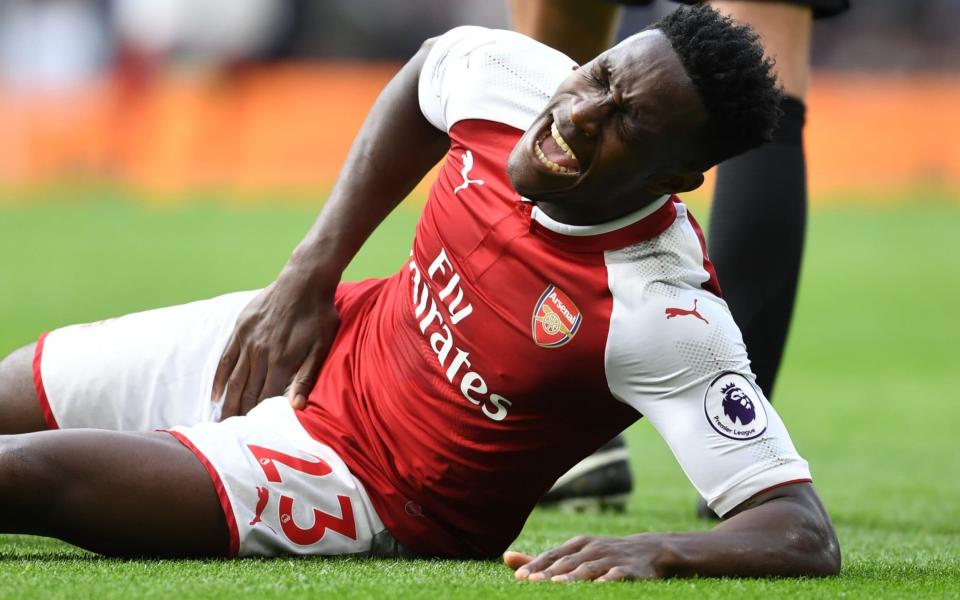 Danny Welbeck lies on the ground in agony - Arsenal FC