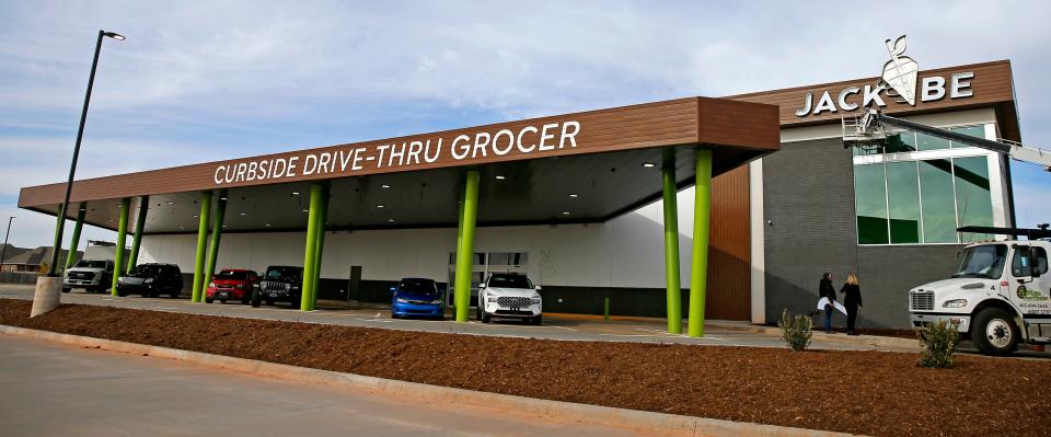 The JackBe grocery store has a large, covered drive-thru area for customers.