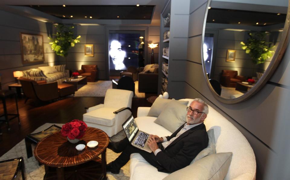 Interior designer Waldo Fernandez poses for a picture in the greenroom for the 84th Annual Academy Awards at the Kodak Theatre in Los Angeles, Thursday, Feb. 23, 2012. The Academy Awards will be held on Sunday.(AP Photo/Chris Carlson)