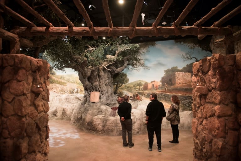 Visitors tour an exhibit recreating what Nazareth may have looked like during Jesus's time