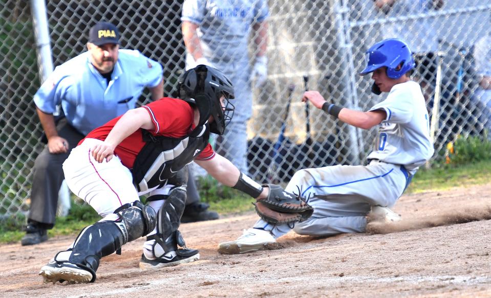 Conemaugh Township catcher Zack Petree tags out Windber's Dalton Strick trying to score during a non-conference baseball contest, April 29, in Davidsville.