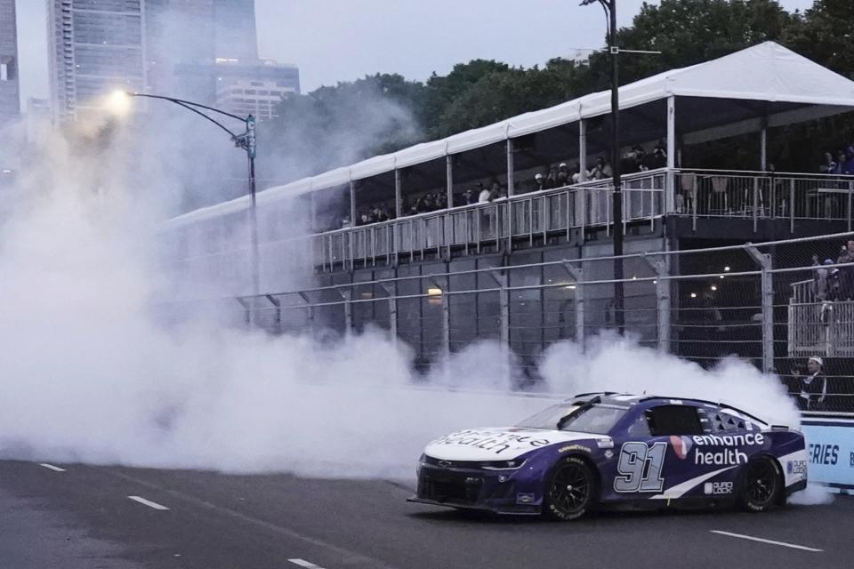 Shane Van Gisbergen celebrates after winning a NASCAR Cup Series auto race at the Grant Park 220 Sunday, July 2, 2023, in Chicago. (AP Photo/Morry Gash)