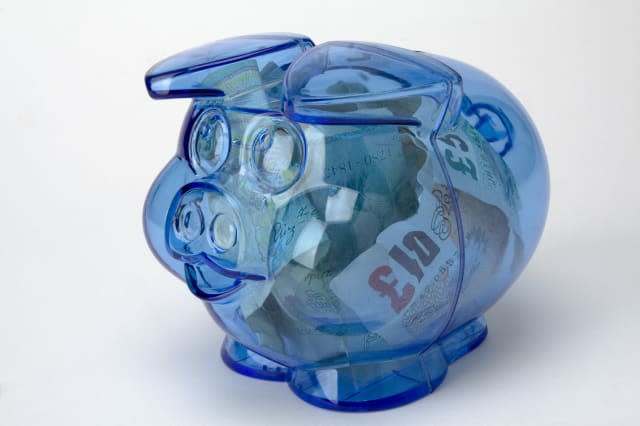 Piggy bank with pound notes money