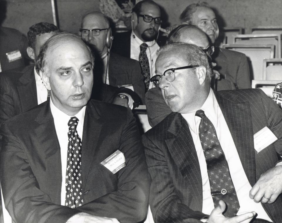 American economist and Under Secretary of the Treasury for International Affairs Paul Volcker (1927 - 2019) (left) and politician and US Secretary of the Treasury George P Shultz talk during the annual International Monetary Fund (IMF) meeting, Washington DC, September 26, 1972. (Photo by Benjamin E. &#39;Gene&#39; Forte/CNP/Getty Images)