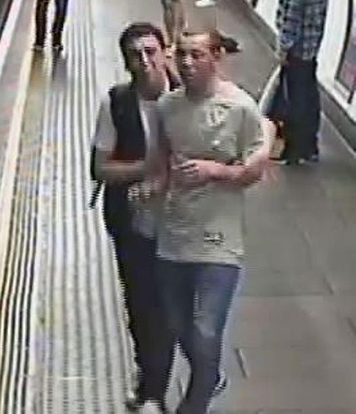 British Transport Police handout CCTV image of two men they will like to speak to following an incident where gas was released on board a train carriage at Oxford Circus station in London