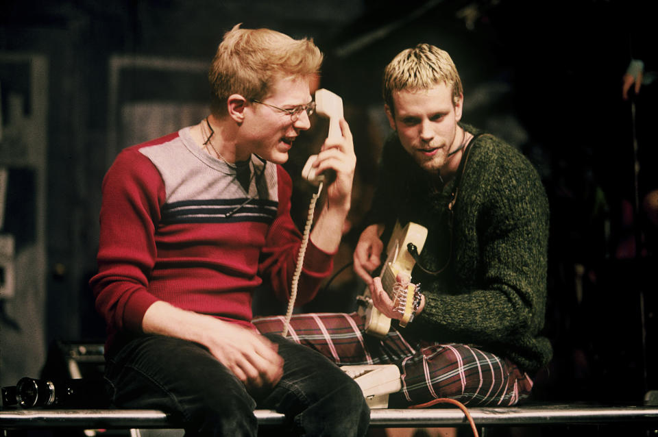 Anthony Rapp, left, and Adam Pascal appear during a performance of the 1996 musical "Rent" in New York. The New York Theater Workshop will celebrate the 25th anniversary of “Rent” with a gala on March 2 that will be available to stream through March 6. Original cast members will be joined by theater stars such as Lin-Manuel Miranda, Neil Patrick Harris and Ben Platt. (Joan Marcus/Matt Ross Public Relations via AP)