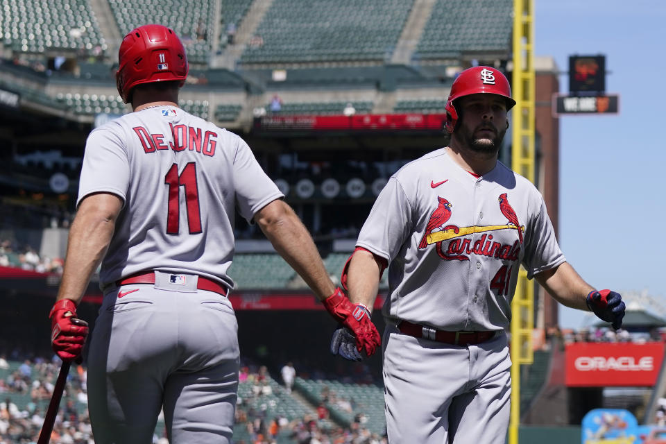 St. Louis Cardinals' Alec Burleson, right, is congratulated by Paul DeJong (11) after hitting a home run during the seventh inning of a baseball game against the San Francisco Giants in San Francisco, Thursday, April 27, 2023. (AP Photo/Jeff Chiu)