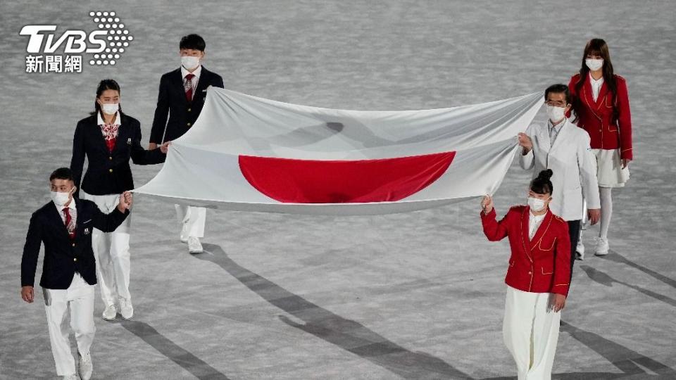 奧運主辦國日本國旗進場。（圖／達志影像美聯社）