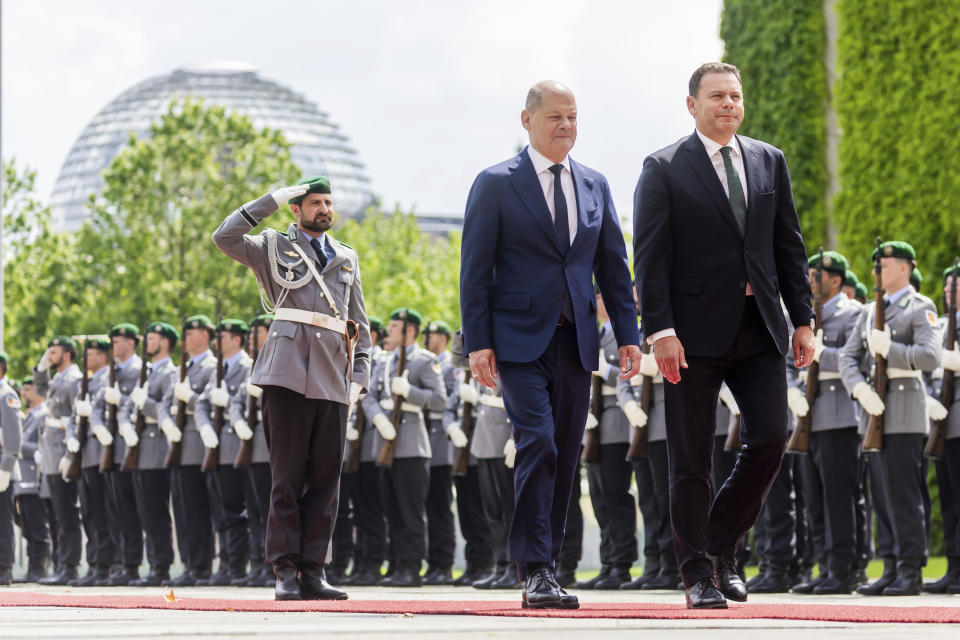 German Chancellor Olaf Scholz, centre, and Portugal's Prime Minister Luis Montenegro walk during their meeting at the Federal Chancellery in Berlin, Friday, May 24, 2024. (Christoph Soeder/dpa via AP)