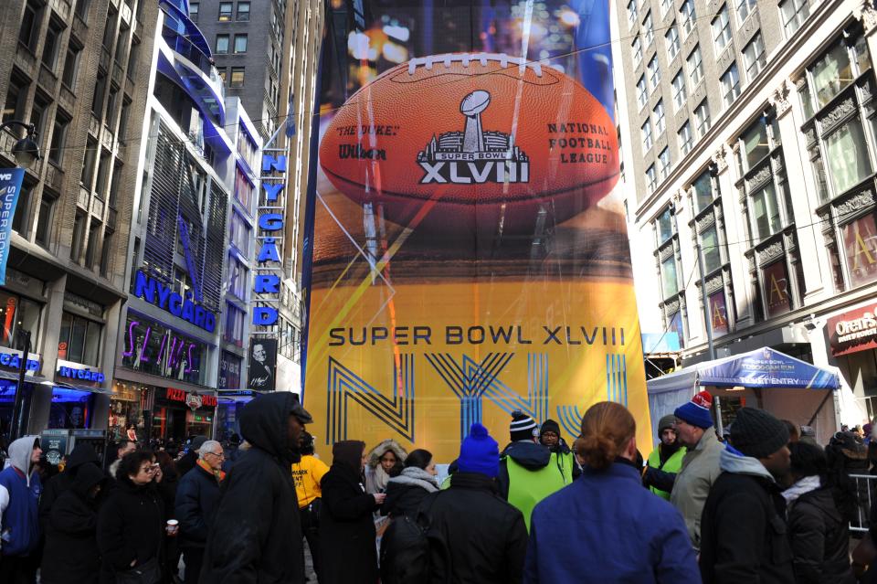 NFL fans experiencing Super Bowl Boulevard in Manhattan before the 2014 Super Bowl at MetLife Stadium in New Jersey.