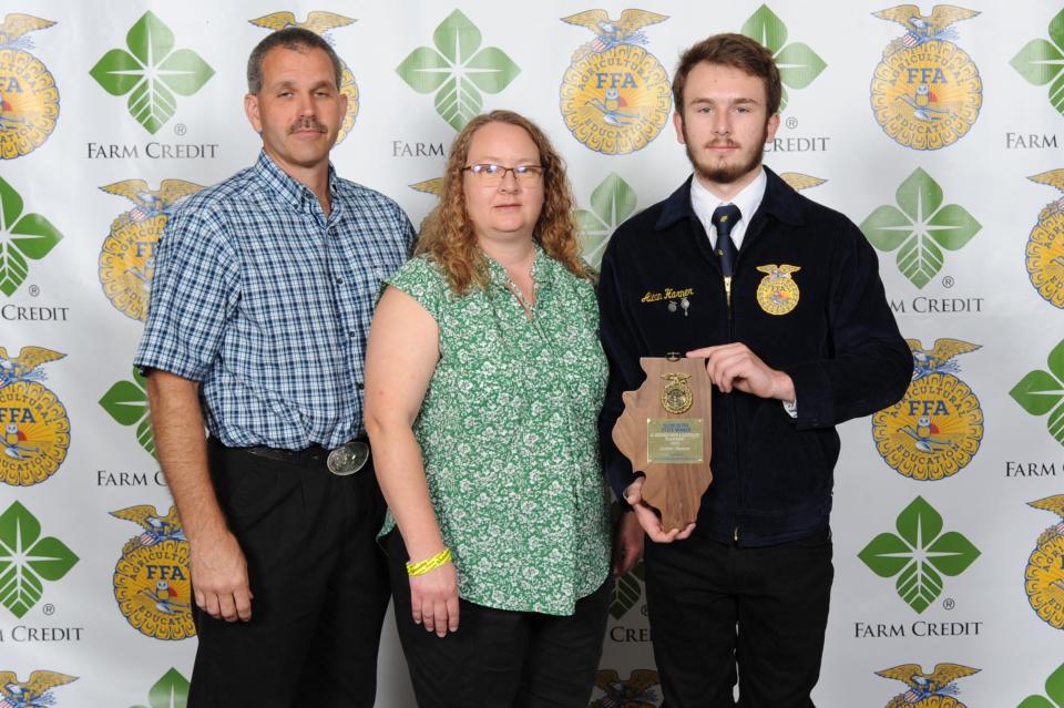 Aiden Harner, right,, shown with parents Mike and Abby Harner, was selected as State FFA Proficiency winner in Agricultural Mechanics-Repair and Maintenance Placement and as the District 2 Star in Agricultural Placement at the 94th annual Illinois State FFA Convention.