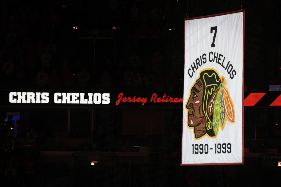 Former Chicago Blackhawks great Chris Chelios has his jersey retired during a ceremony before an NHL hockey game between the Chicago Blackhawks and Detroit Red Wings Sunday, Feb. 25, 2024, in Chicago. (AP Photo/Paul Beaty)